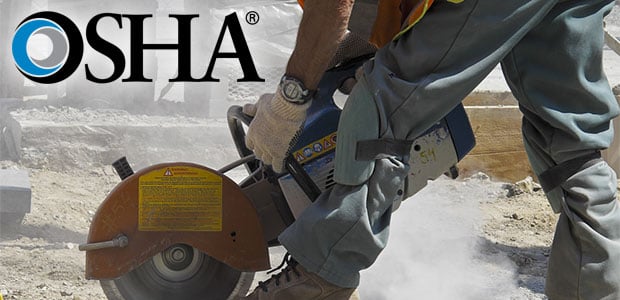 Worker cutting concrete creating silica dust