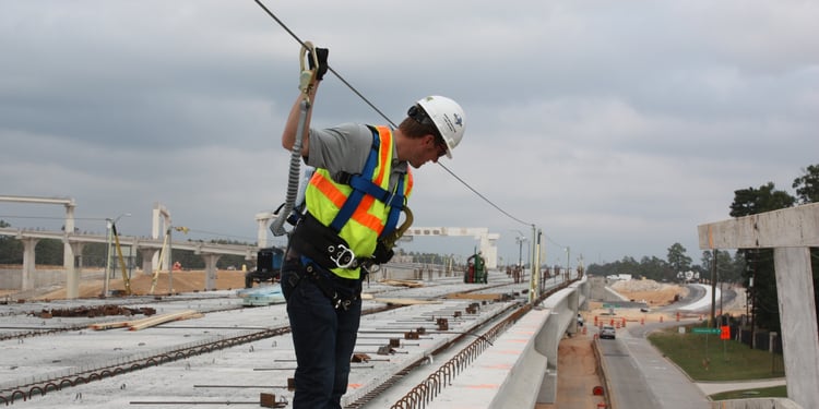 Constructon worker using fall protection